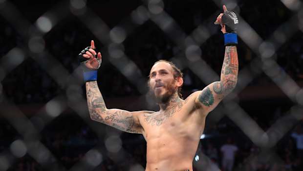 Nov 6, 2021; New York, NY, USA; Marlon Vera (blue gloves) celebrates after defeating Frankie Edgar (red gloves) during UFC 268 at Madison Square Garden.